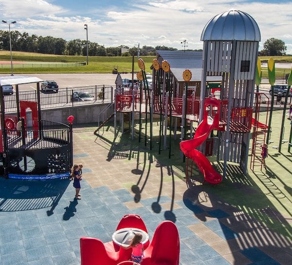 Braden and Friends Challenger Playground that resembles a farm and river community.