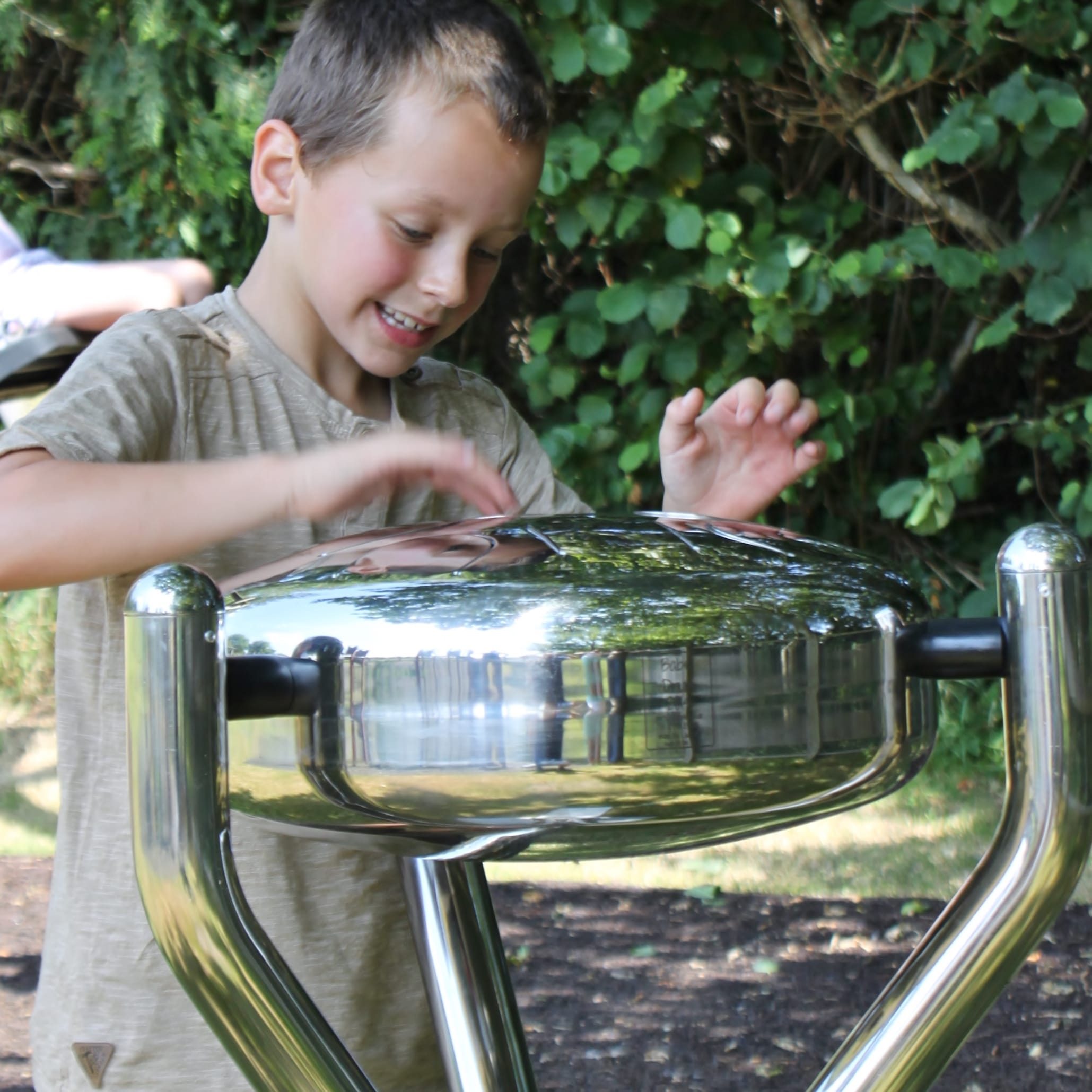 Child beating on a Babel Drum