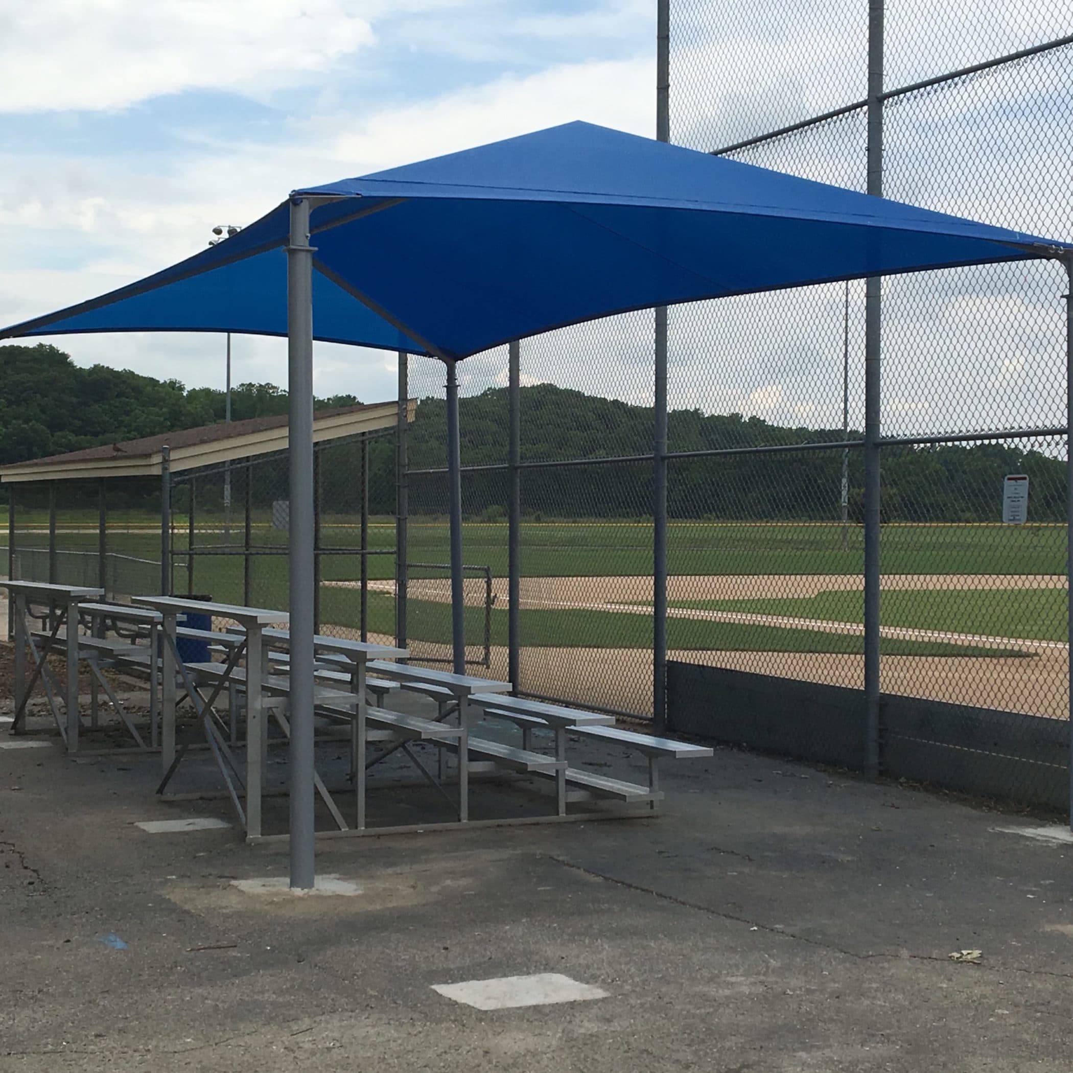 Shaded bleachers at a baseball park.