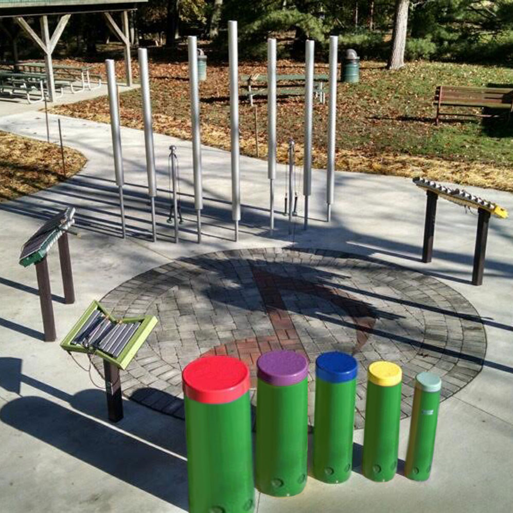 Outdoor musical instruments at a community group playground.